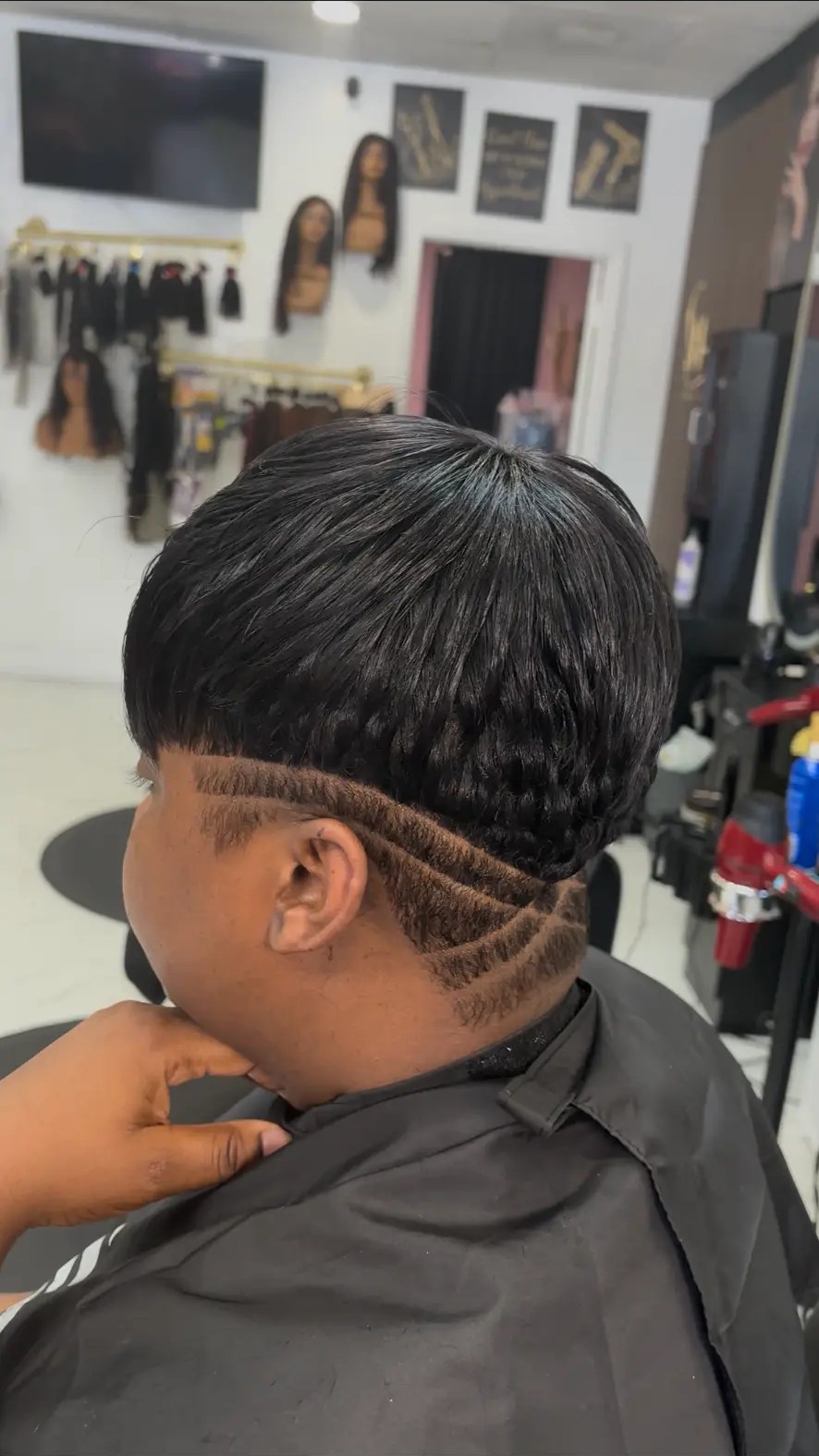 Layered bob with a carved nape design at Carmie Hair in Miramar, FL